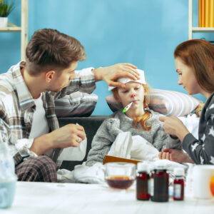 young woman man with sick daughter home home treatment fighting with desease medical healthcare family iilness winter influenza health pain parenthood relationship concept